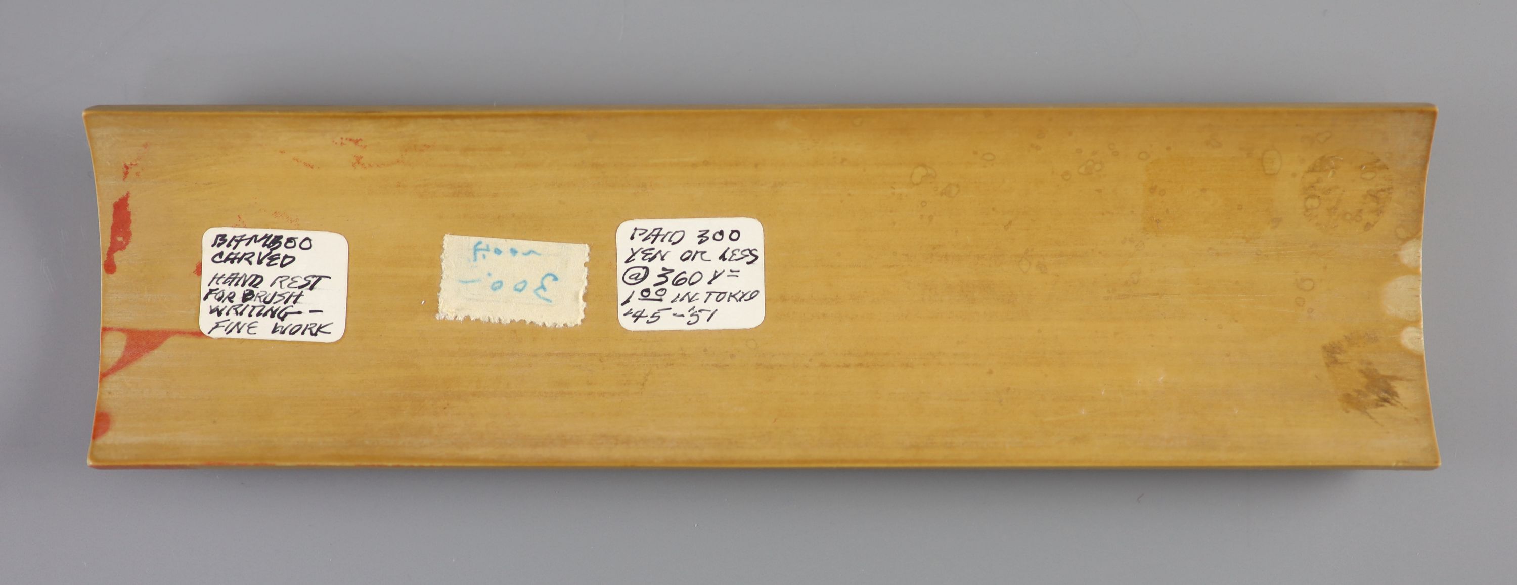 A Chinese carved bamboo wrist rest, Republic period, 22.7 cm long